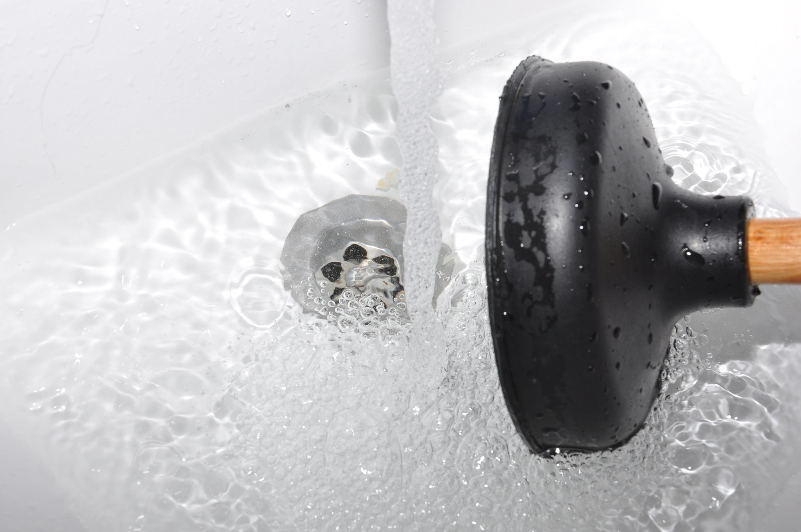 Clearing a blocked drain